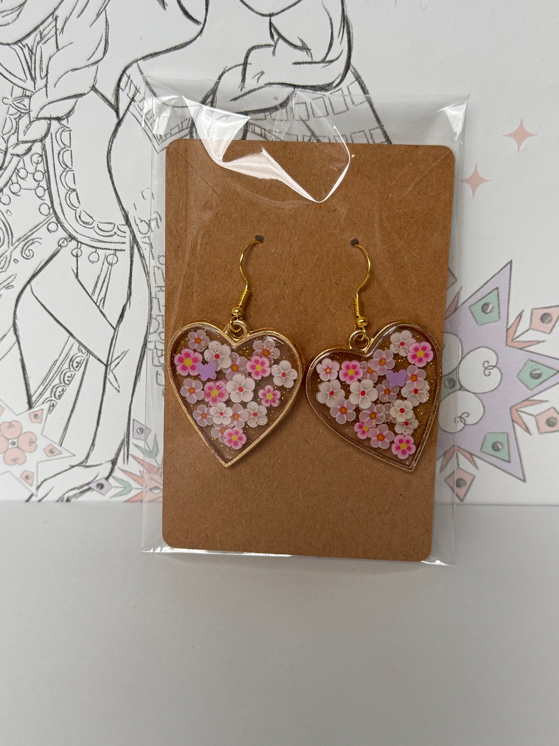 Heart-shaped earrings with floral design inspired by rapunzel